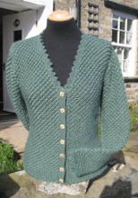 Ladies hand-knitted Smarber cardigan in forest green Wensleydale wool.